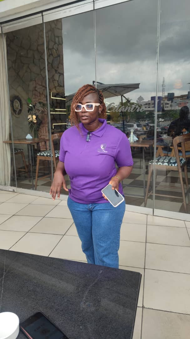 A TemiNest team member in our purple uniform