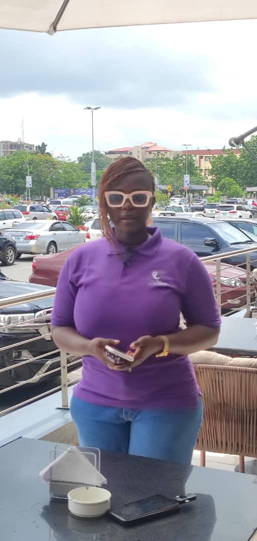 A TemiNest team member in our purple uniform